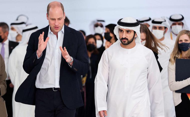Prince William and Dubai's Crown Prince Sheikh Hamdan bin Mohammed bin Rashid Al Maktoum walk during a tour at the Expo 2020 in Dubai