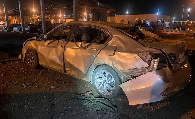 A car damaged by Houthi's drone attack at an Aramco oil terminal in the southern Saudi border town of Jizan o