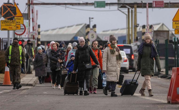 Refugees from Ukraine are pictured after crossing the Ukrainian-Polish border