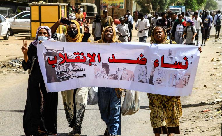 Women against the military coup, reads the banner