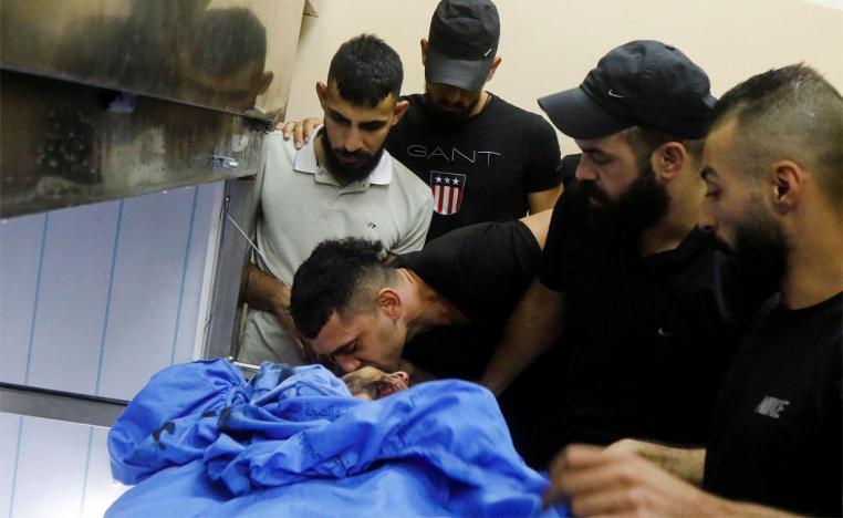 People react after Israeli forces killed Palestinian Younes Tayeh