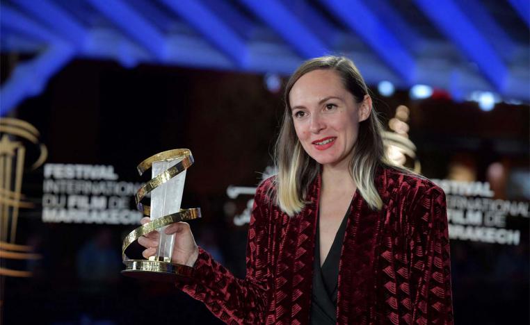 Swiss director and screenwriter Carmen Jaquier poses with her Best Direction Award award