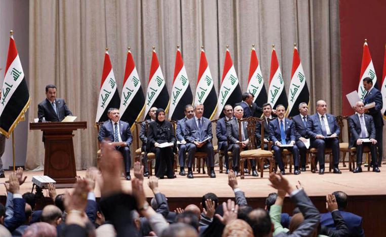 رئيس الحكومة العراقية محمد شياع السوداني والوزراء بعد إقرار تكليفهم من البرلمان