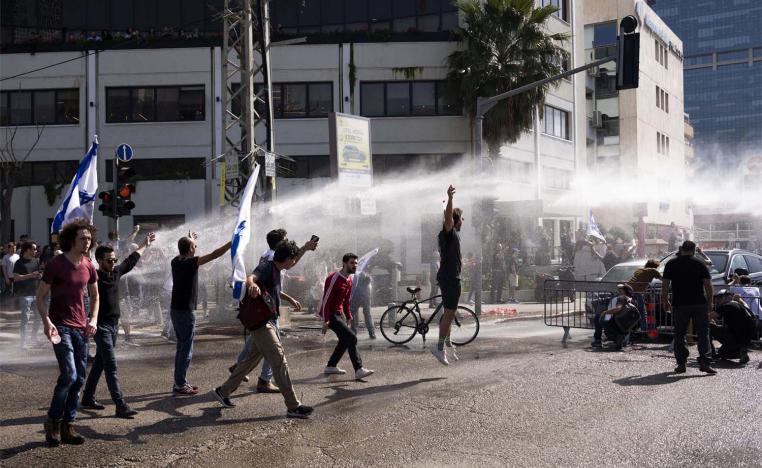 Water cannon to disperse the protests