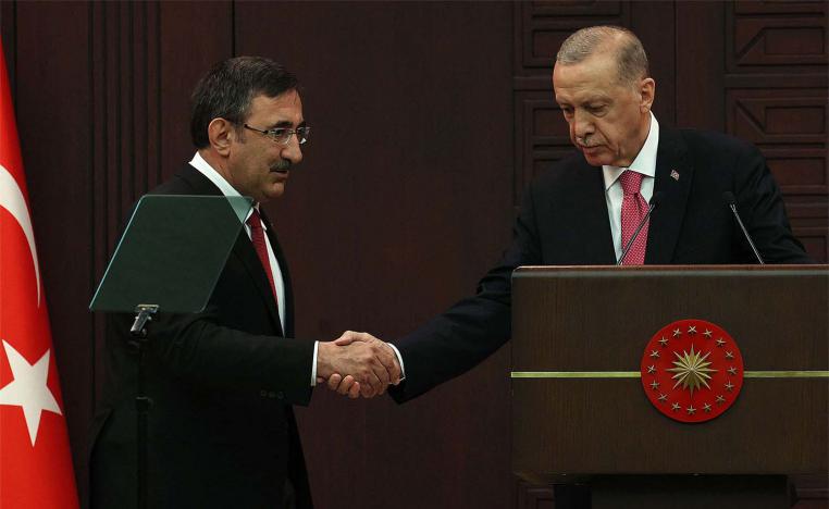 Turkey's new vice president Cevdet Yilmaz (L)