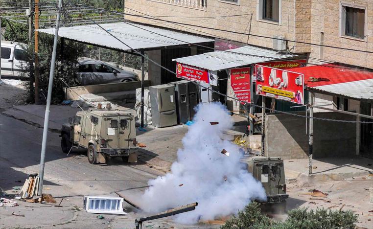 An explosion enveloped an armoured troop carrier