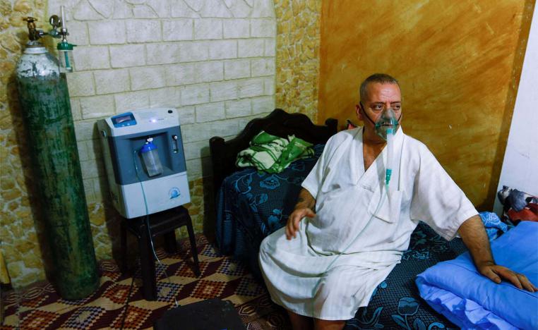 Ismail Nashwan struggles for breath at his house amid a heatwave in Al Burij refugee camp