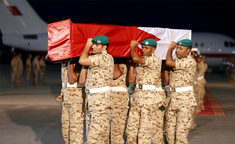 An archive photo of the coffin of a Bahraini soldier is carried by a guard of honour in September 2015