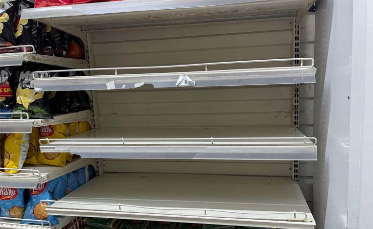 Empty shelves are seen in the rice section inside a supermarket in Tunis