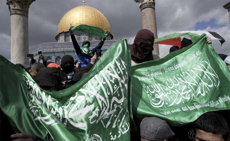 Palestinians display Hamas militant flags