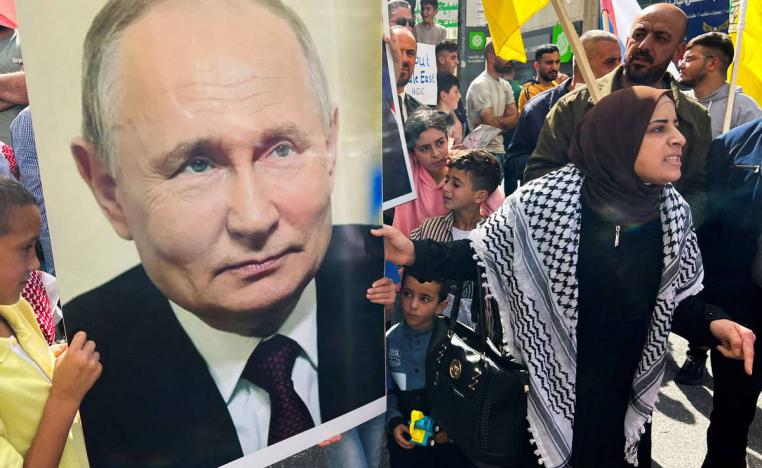 فلسطينيون يرفعون صورة بوتين في الخليل