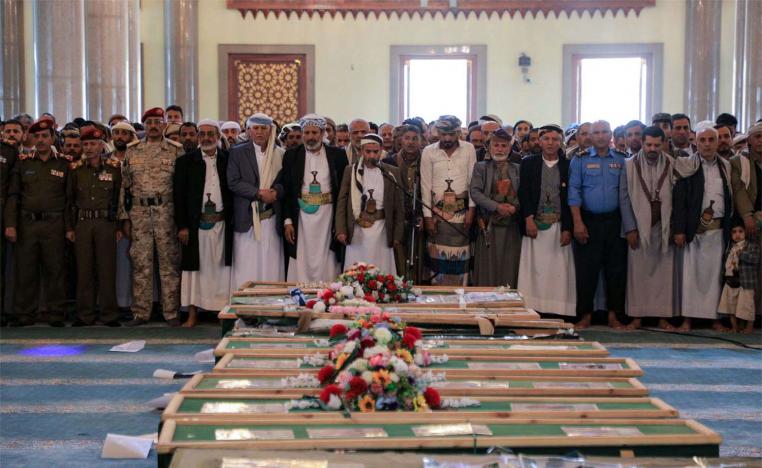 Mourners gather to pray near the coffins of Houthi rebels who were killed in recent US-led strikes, in Sanaa's Al-Saleh mosque