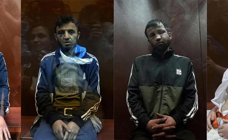 The four suspects sitting inside the defendant cage waiting for their pre-trial detention hearing at the Basmanny District Court in Moscow