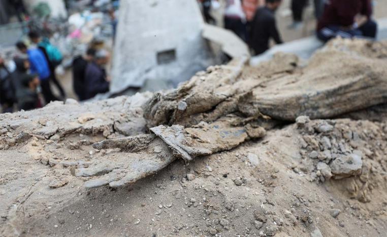 A decomposed body lies on the ground at Al Shifa Hospital after Israeli forces withdrew from the hospital