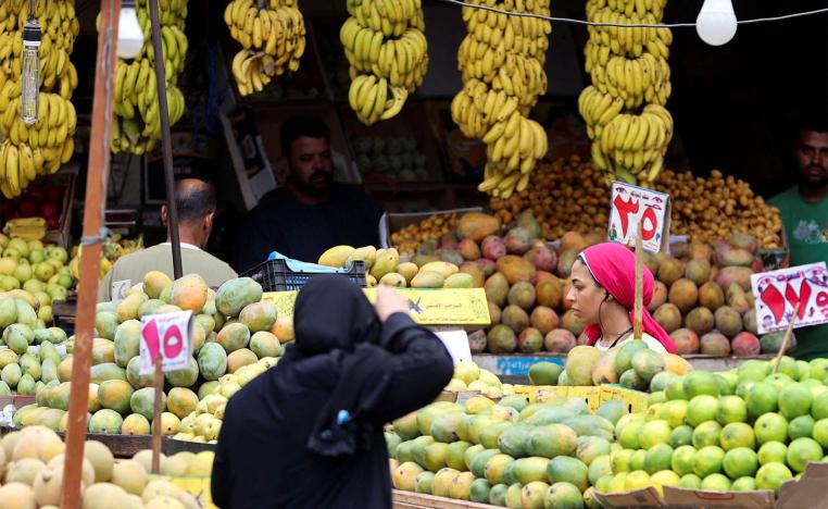 A woman shops at a market in Cairo