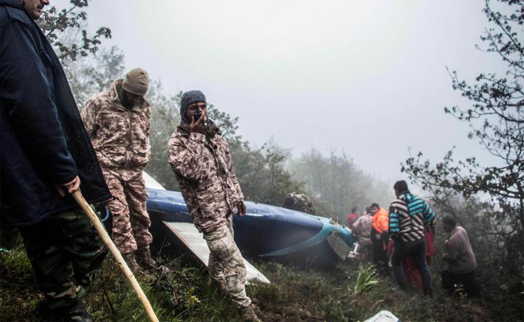 Rescue team members at the crash site of a helicopter carrying Iranian President Raisi in Varzaghan