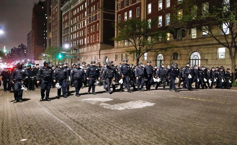 NYPD officers in riot gear march onto Columbia University campus