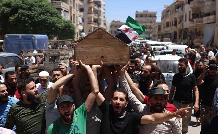 Syrians attend the funeral procession of a man killed during clashes with Turkish troops in Afrin in northern Syria