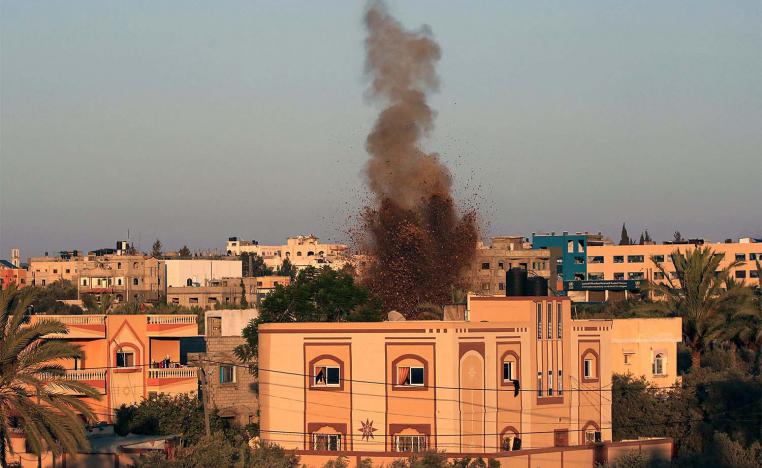 Smoke and soil billow after an Israeli strike in al-Zawayda in the central Gaza Strip 