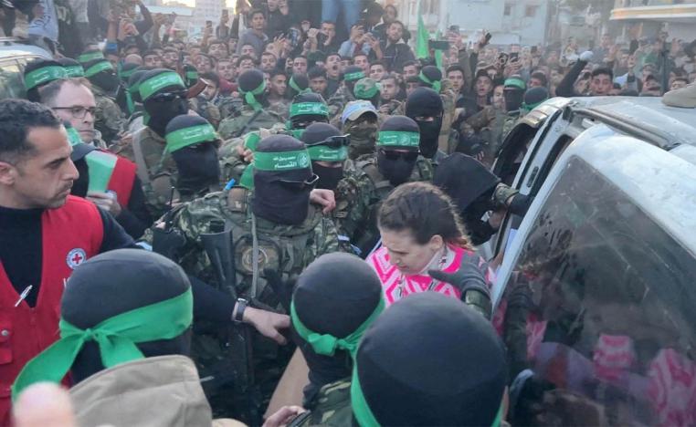 Palestinian Hamas militants hand over Doron Steinbrecher, a hostage who had been held in Gaza 