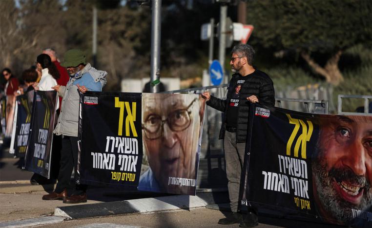 An Israeli official says the deal includes hostage releases and phased withdrawals