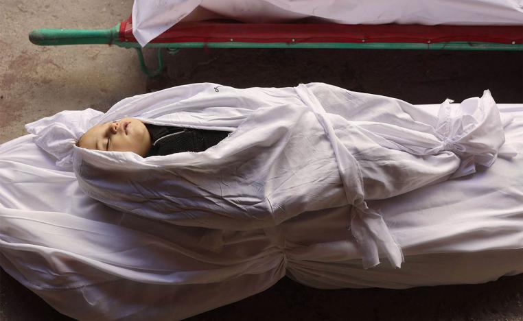 The shrouded body of a child killed in an overnight Israeli airstrike on the Gaza Strip 