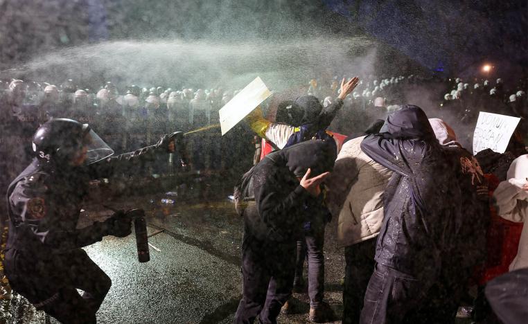 Police officers use pepper spray on demonstrators during a protest against the detention of Istanbul Mayor Ekrem Imamoglu