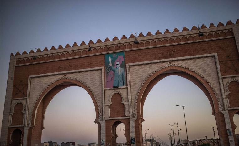 An archway in the entrance of Dakhla carries an image of Morocco's King Mohammed VI