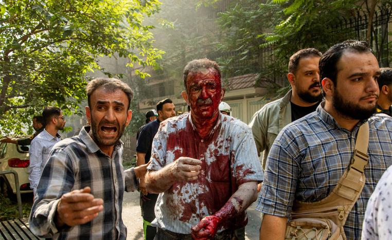 A wounded man reacts following the Israeli strikes on Tehran