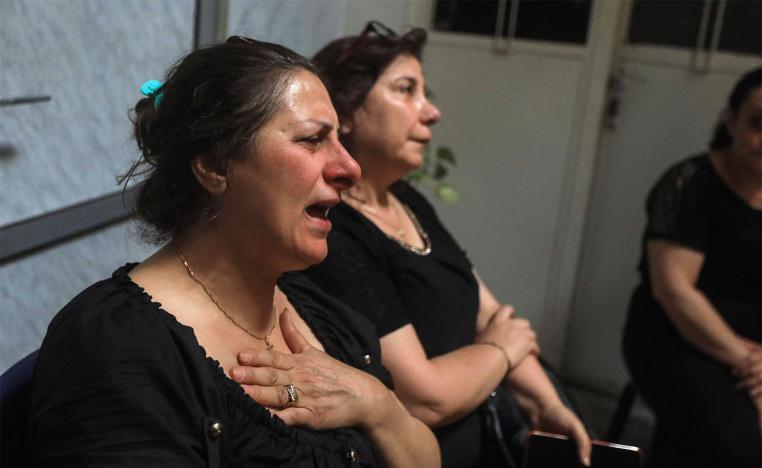  Relatives and friends mourn with members of the Bechara family who lost several members in the suicide attack at the Saint Elias church