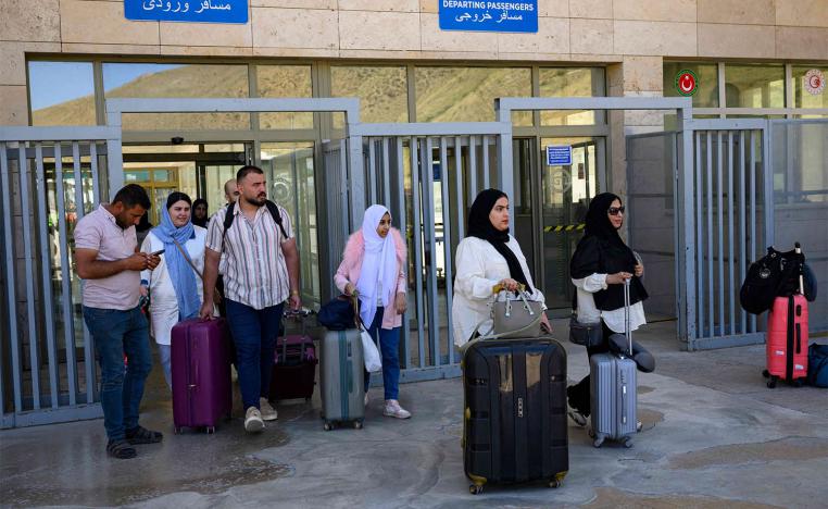Iranians arrive in Turkey via the Razi-Kapikoy border crossing, north-eastern Turkey