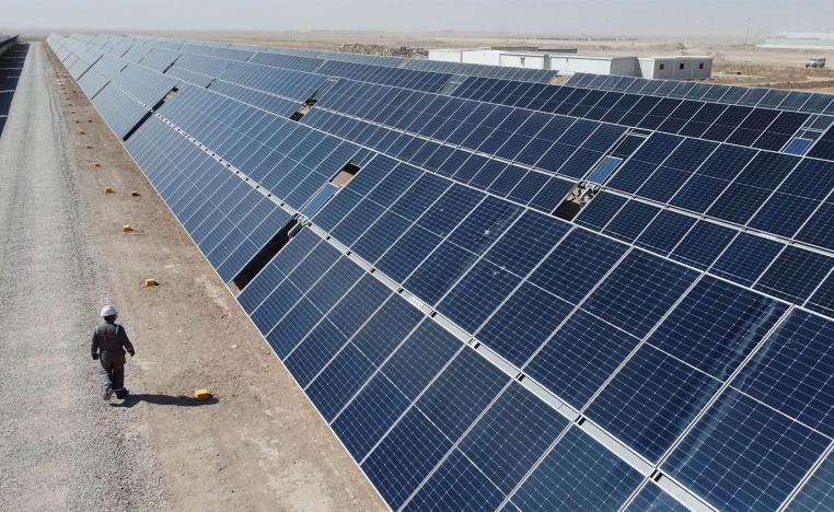 A general view shows solar panels at the Faihaa oil field in Basra