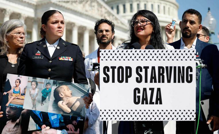 US Rep. Rashida Tlaib (D-MI), joined by Palestinian rights activists, protests for more food aid to Gaza