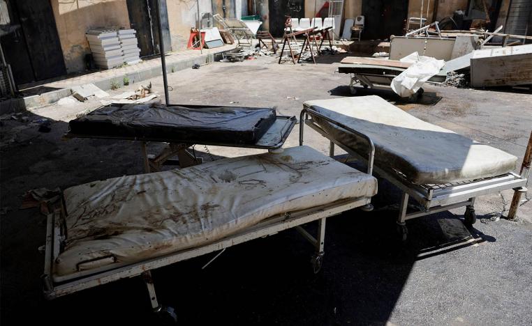 Stretchers stand outside a hospital in Sweida