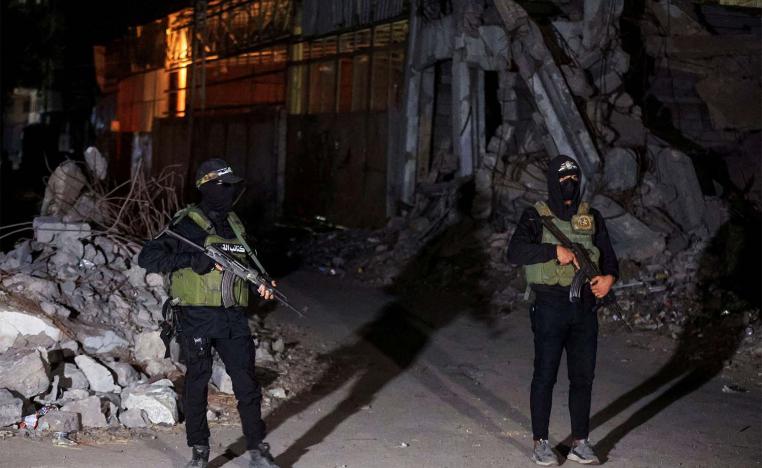 Hamas militants stand guard in Gaza