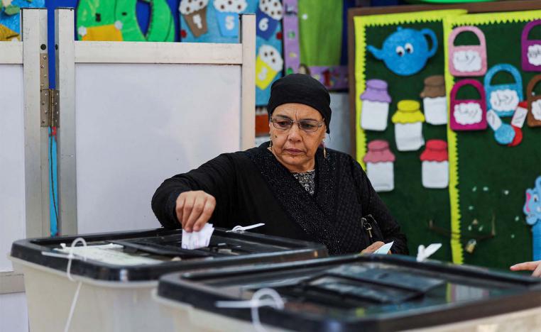 A woman votes at a school used as a polling station in Giza