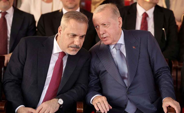 Turkish President Recep Tayyip Erdogan and Turkish Foreign Minister Hakan Fidan attend a military parade in the Turkish-controlled northern Cyprus, in the divided city of Nicosia, July 20, 2025. 