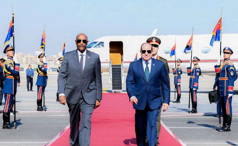 Egyptian President Abdel Fattah al-Sisi welcomes with army chief Abdel Fattah al-Burhan at Cairo International Airport, December 18, 2025. 