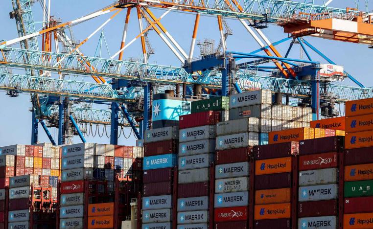 Cranes unload Containers off the Maribo Maersk container ship at a terminal wharf in Bremerhaven, Germany, August 13, 2025. 