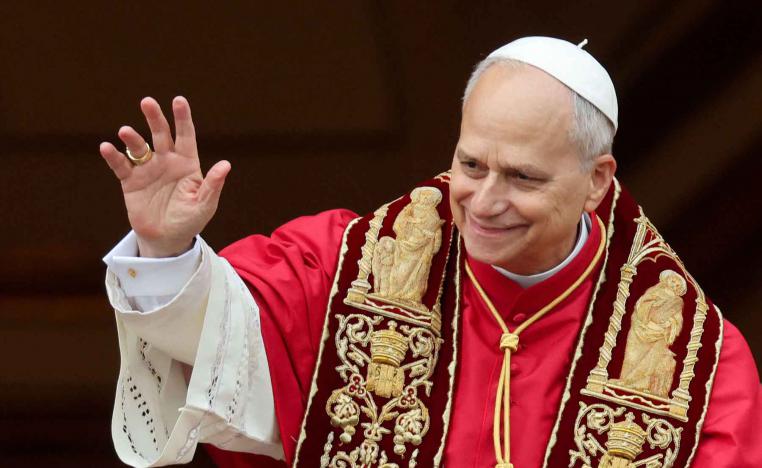 Pope Leo XIV gestures after delivering the traditional Christmas Day Urbi et Orbi speech to the city and the world from the main balcony of St. Peters Basilica at the Vatican, December 25, 2025. 