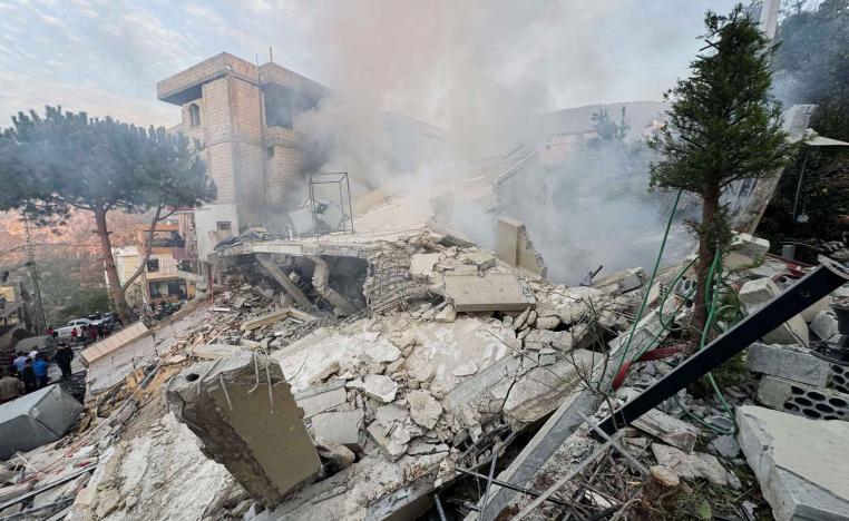 People inspect a damaged site after Israel’s military said it struck targets in two southern Lebanese towns, December 4, 2025. 