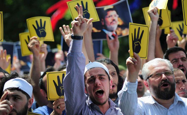 A 2015 file picture shows pro-Islamist demonstrators holding signs that show the Rabaa hand gesture, which symbolises support for the Muslim Brotherhood, during a rally in in Istanbul, Turkey. 