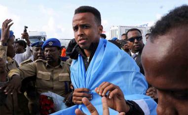 Artan is received as he arrives at the Aden Abdulle Osman International Airport in Mogadishu