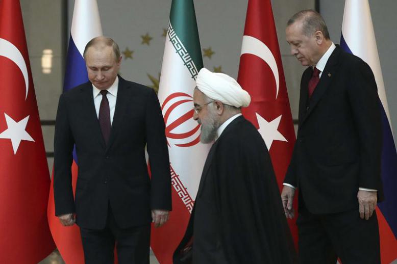  Iranian President Hassan Rohani (C), Russian President Vladimir Putin (L) and Turkish President Recep Tayyip Erdogan meet in Ankara, on April 4