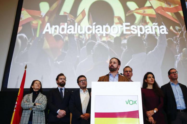 Spain’s far-right Vox party leader Santiago Abascal (C-R) speaks during a news conference in Seville, December 3