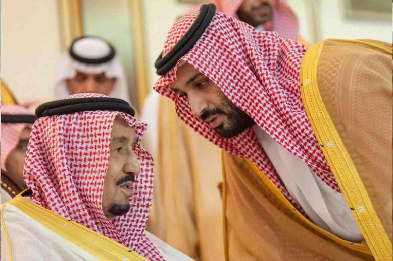Saudi Crown Prince Mohammed bin Salman bin Abdulaziz (R) speaks with King Salman bin Abdulaziz Al Saud in Riyadh