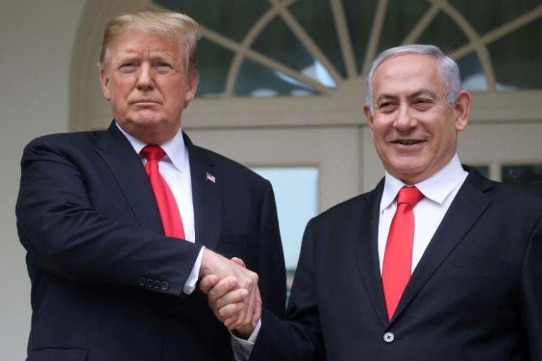 US President Donald Trump shakes hands with Israel's Prime Minister Benjamin Netanyahu as they pose on the West Wing colonnade in the Rose Garden at the White House