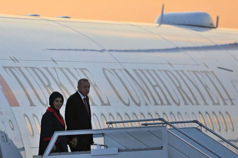 Turkey's President Recep Tayyip Erdogan, accompanied by his wife Emine, arrives at Ataturk airport
