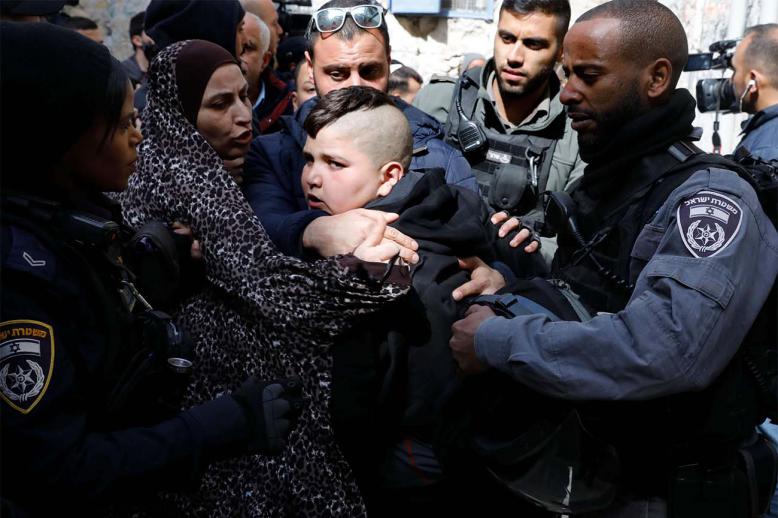  Israeli policemen detain a member of the Abu Asab family as he protested their eviction by the police from the house they lived in for decades, in the Old City of Jerusalem