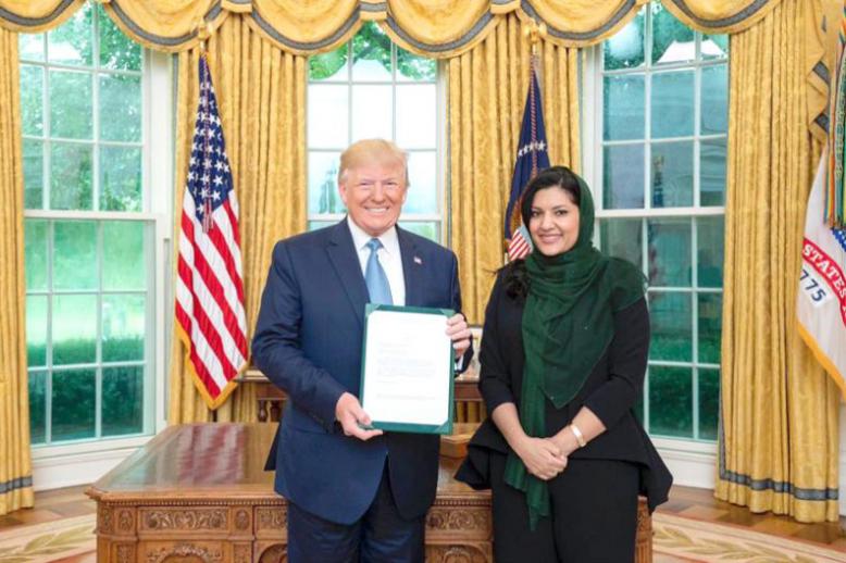 Saudi Arabia’s new Ambassador to the United States Princess Reema bint Bandar bin Sultan (R) presents her credentials to US President Donald Trump in Washington